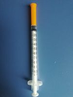 Disposable insulin syringe with needle
