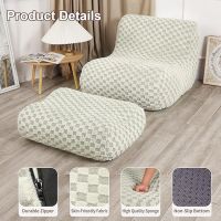 Bean bag chair with an ottoman, a modern lazy lounge chair, suitable for living rooms and bedrooms. A cream-colored modern floor sofa. 