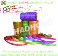 ribbon spool , packing material , curling ribbon .