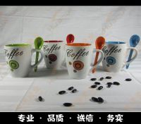 ceramic coffee cup with spoon