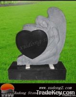 The headstone of  angle with heart