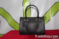 snakeskin-patterned leather handbag