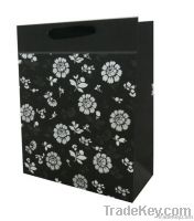 Promotional paper carrier bag with silver stamping flowers