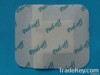 Non-woven adhesive dressing