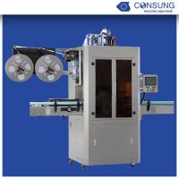 Label sleeving machine for bottles