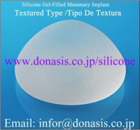 Silicone gel-filled mammary implant