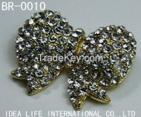 plating and stones brooch